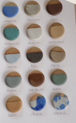 The sixteen Settle Ceramics glazes, shown as fired ceramic samples.